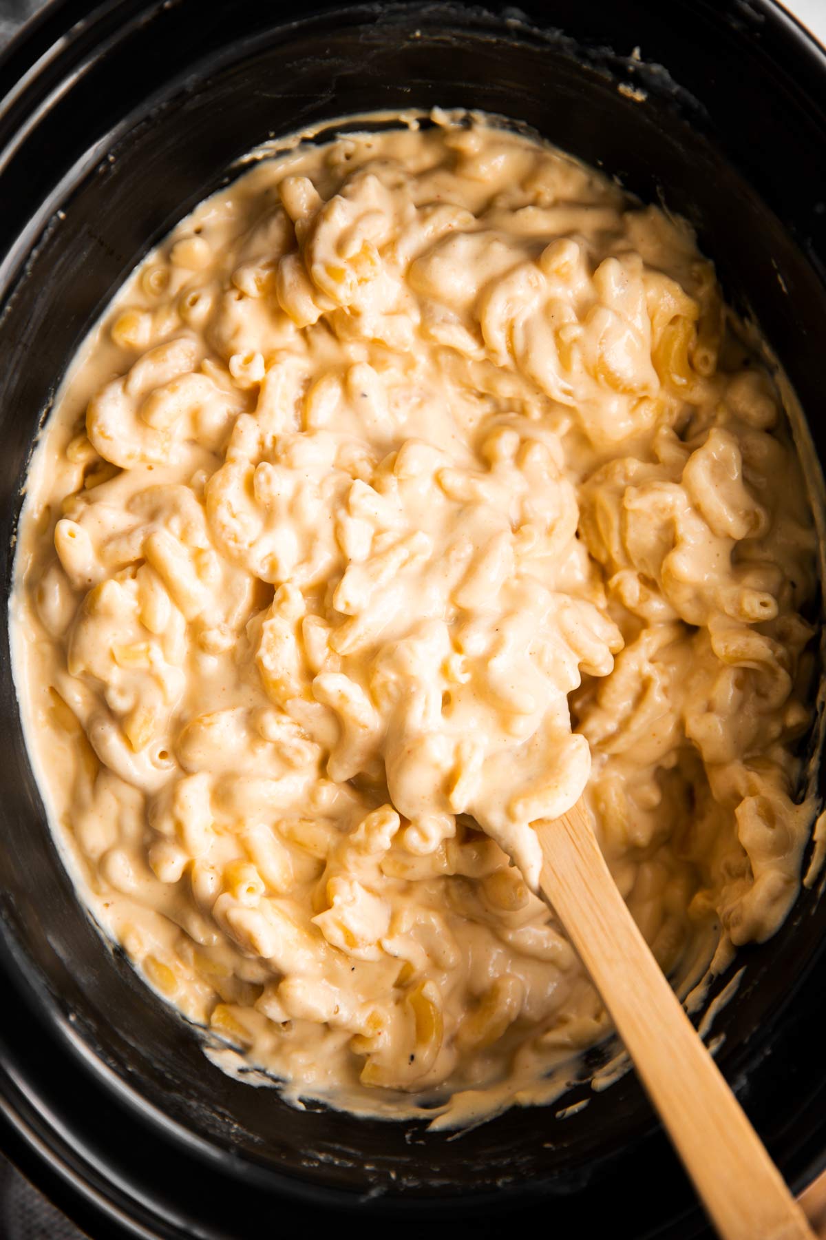 close up of crockpot with macaroni and cheese inside