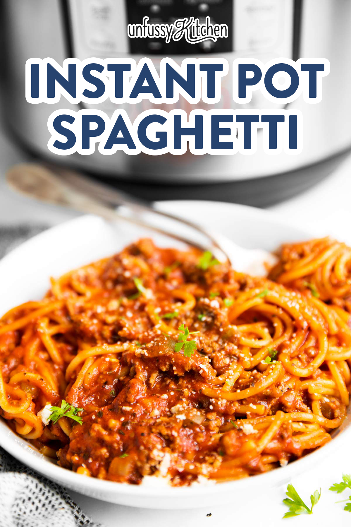 plate with spaghetti and meat sauce in front of instant pot with text overlay