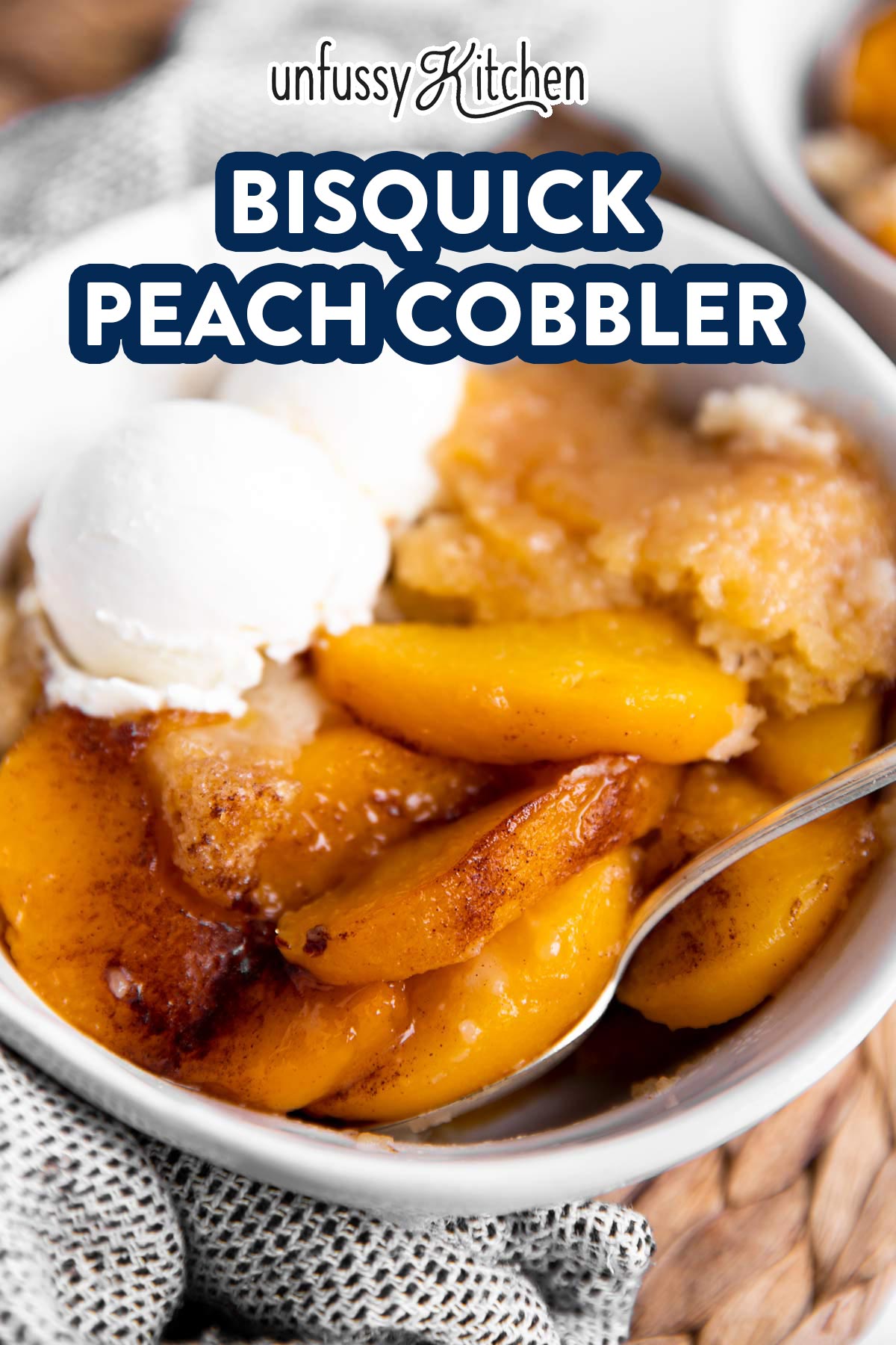 close up of bowl with peach cobbler with text overlay
