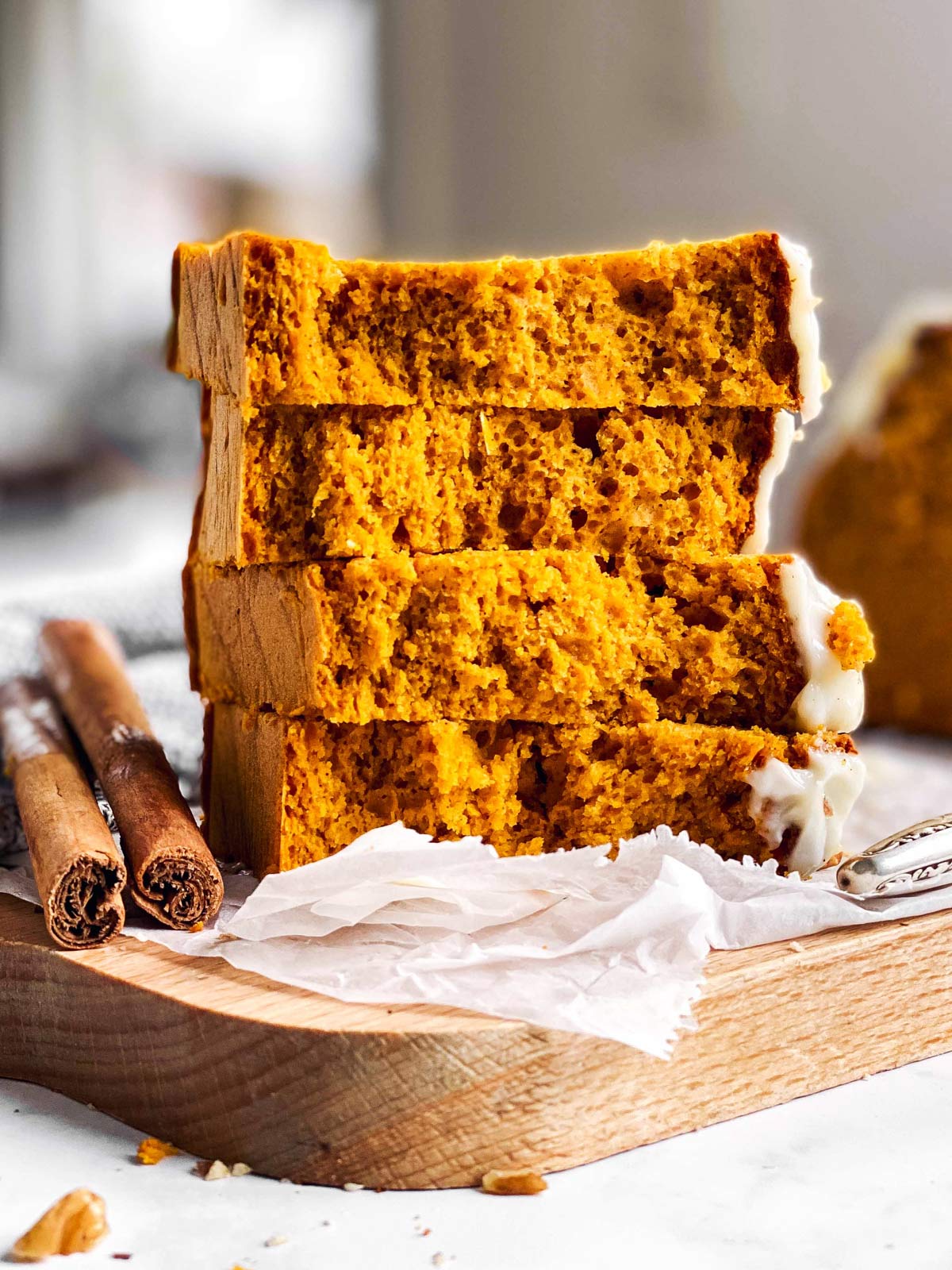 stack of halved pumpkin bread slices