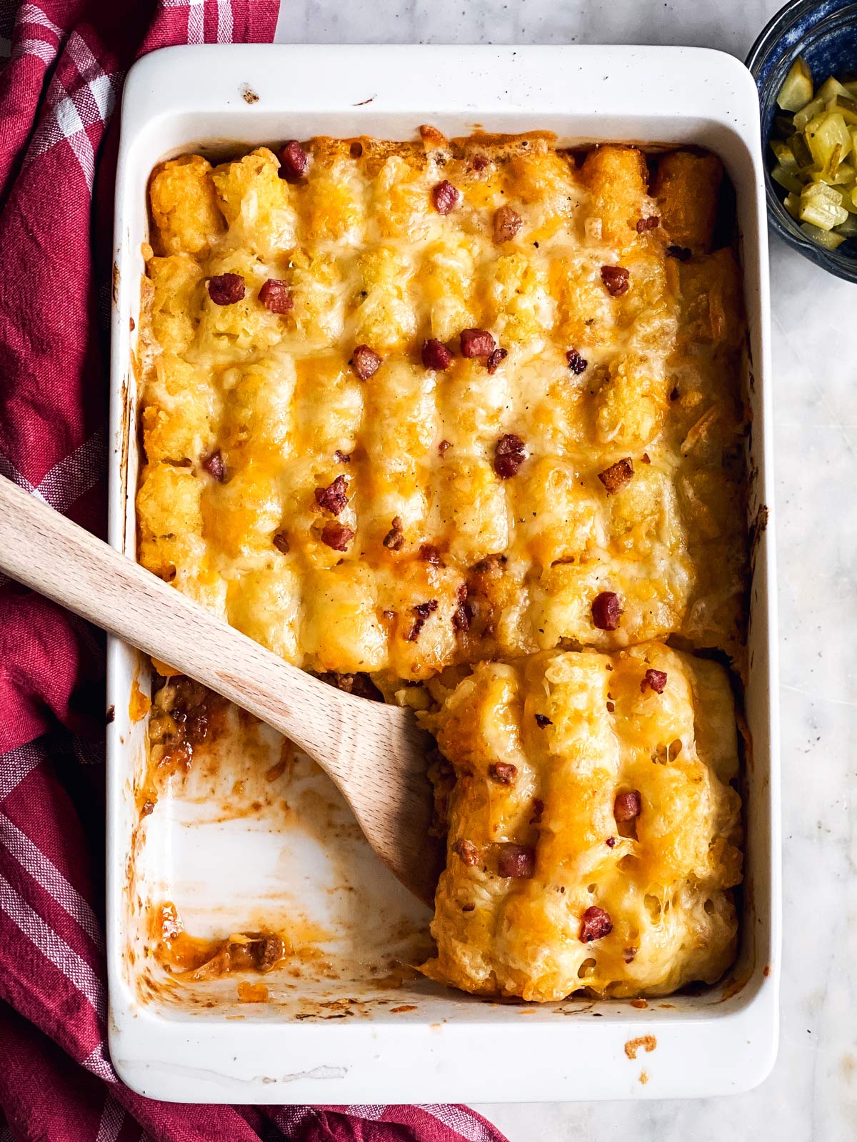 white casserole dish with bacon cheeseburger casserole