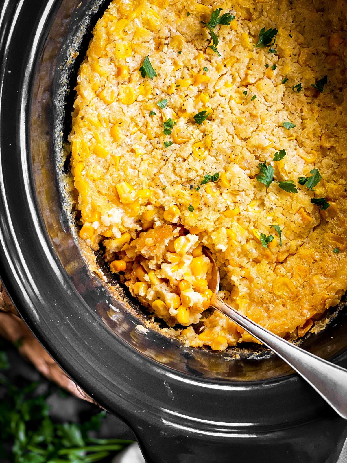 close up of corn casserole in crock