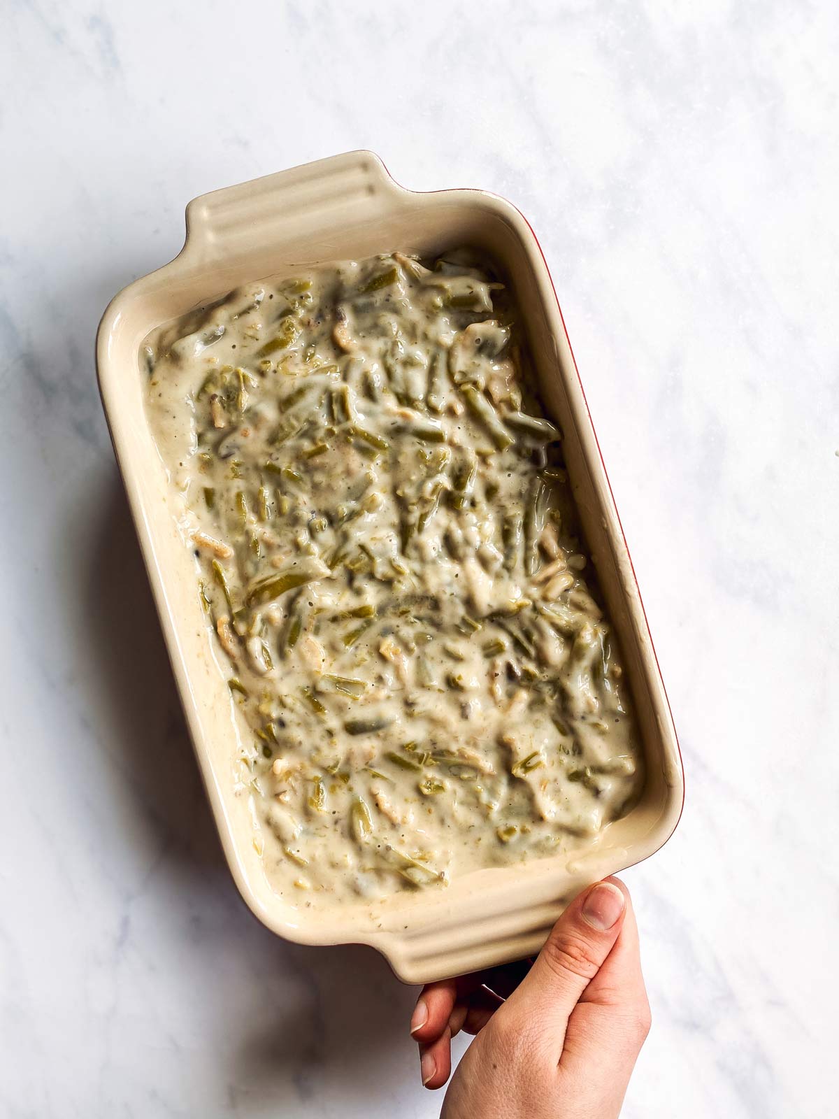 casserole dish with unbaked green bean casserole