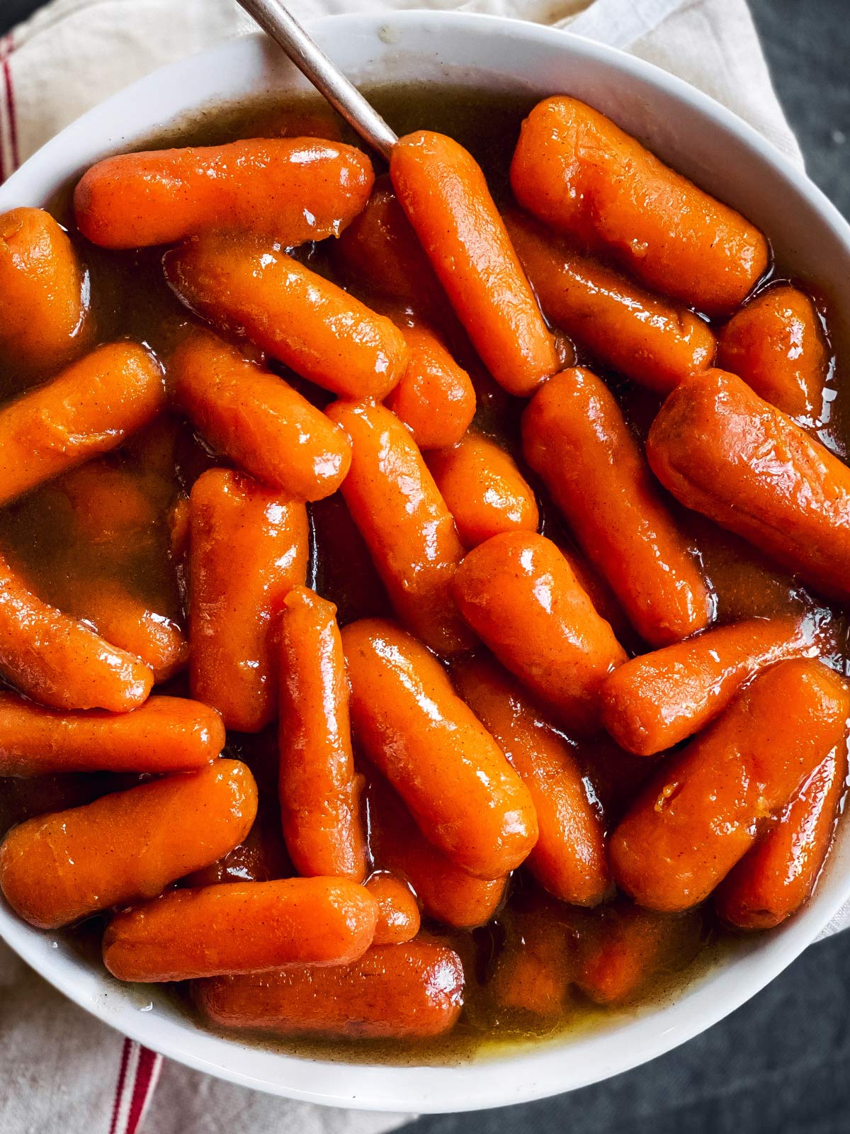 close up of bowl with glazed carrots