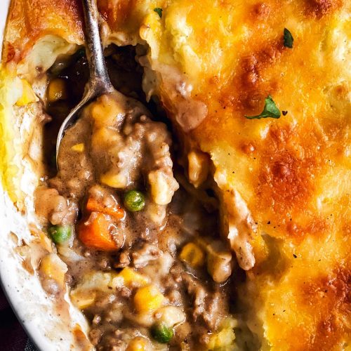 close up photo of serving spoon in shepherd's pie casserole