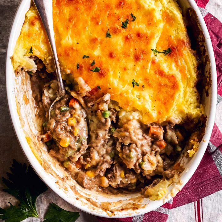 overhead view of shepherd's pie topped with instant mashed potatoes in white casserole dish