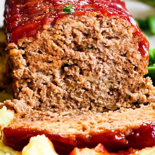 close up frontal view of sliced meatloaf