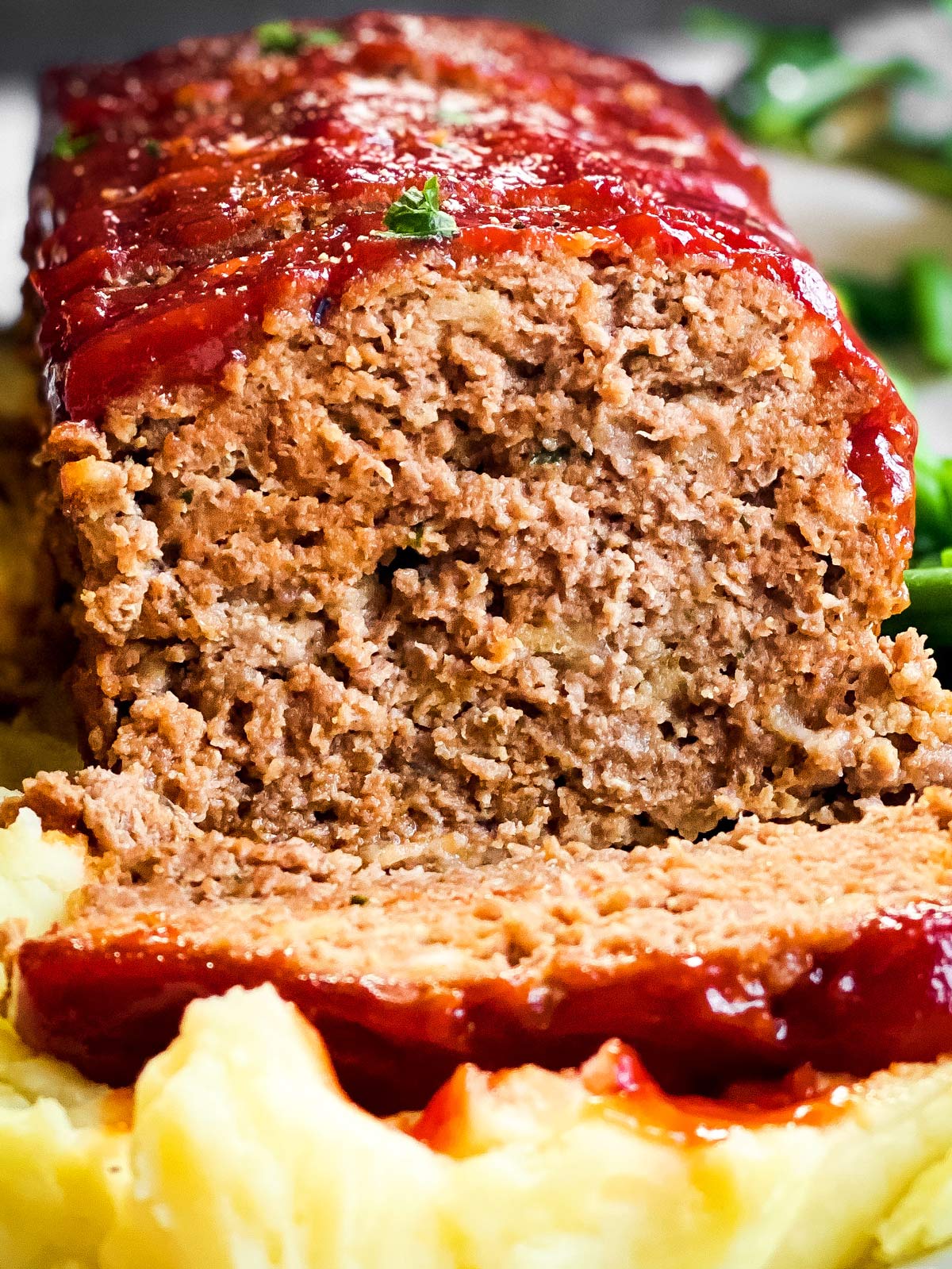 close up frontal view of sliced meatloaf