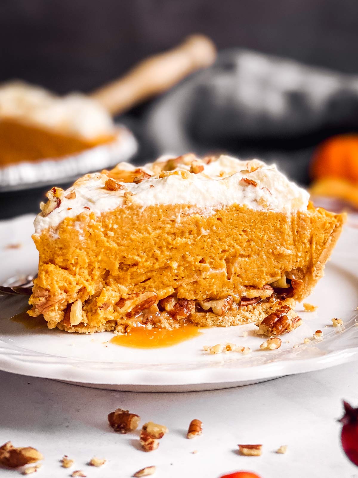 slice of turtle pumpkin pie on a white plate