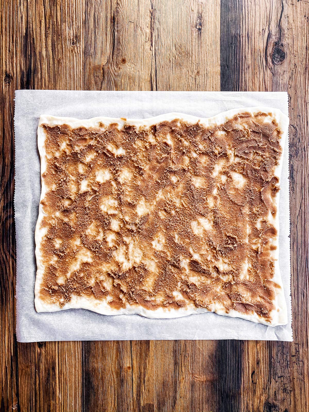 bread dough spread with cinnamon sugar butter