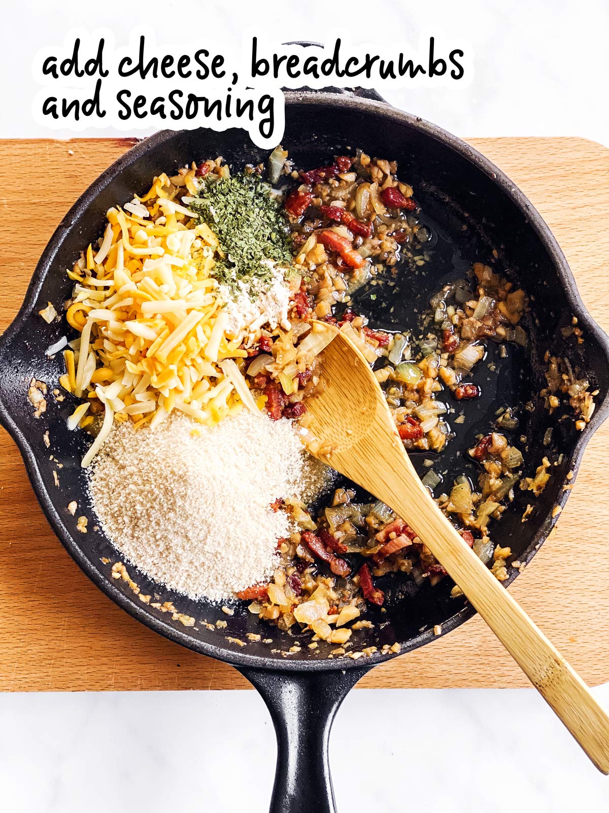 ingredients for stuffed mushroom filling in cast iron skillet