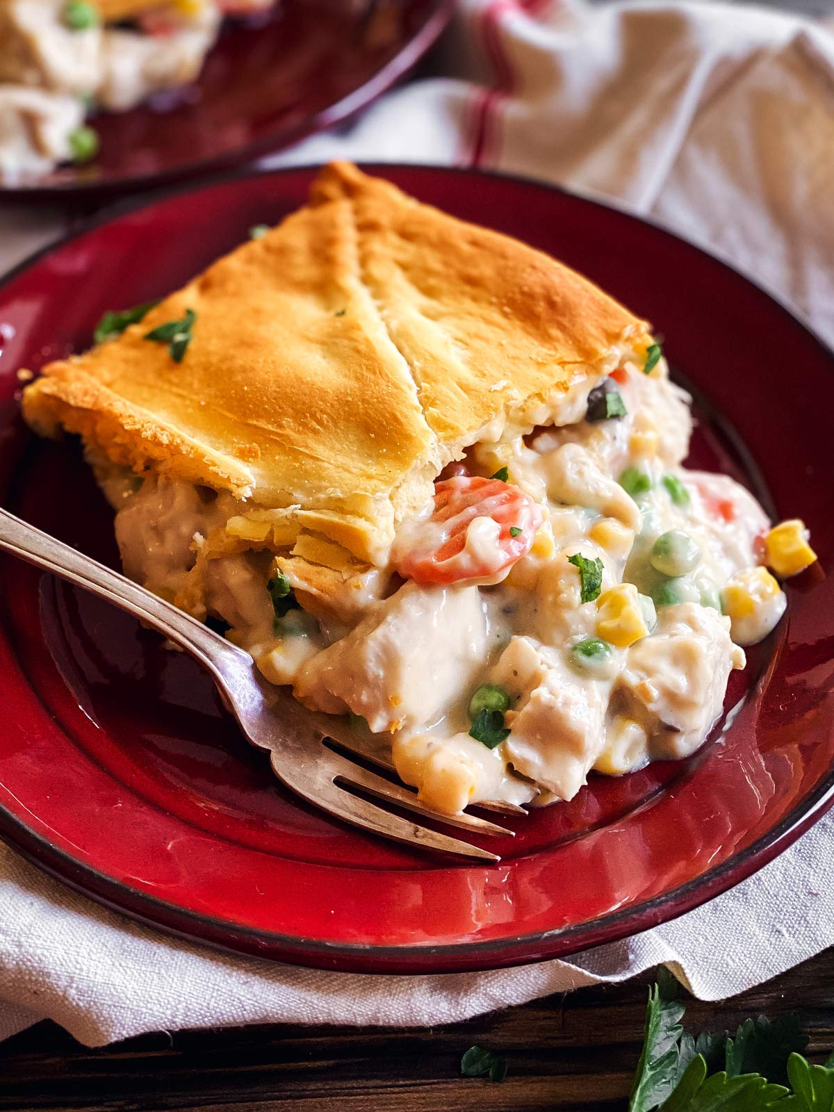 slice of leftover turkey pot pie on red plate