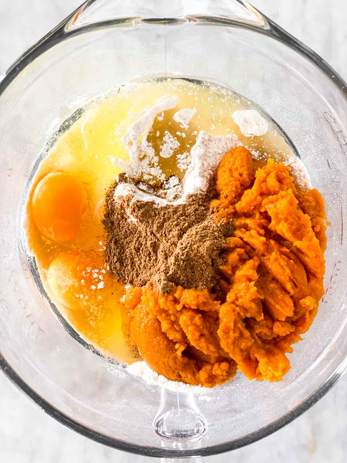 ingredients for cake mix pumpkin muffins in glass bowl