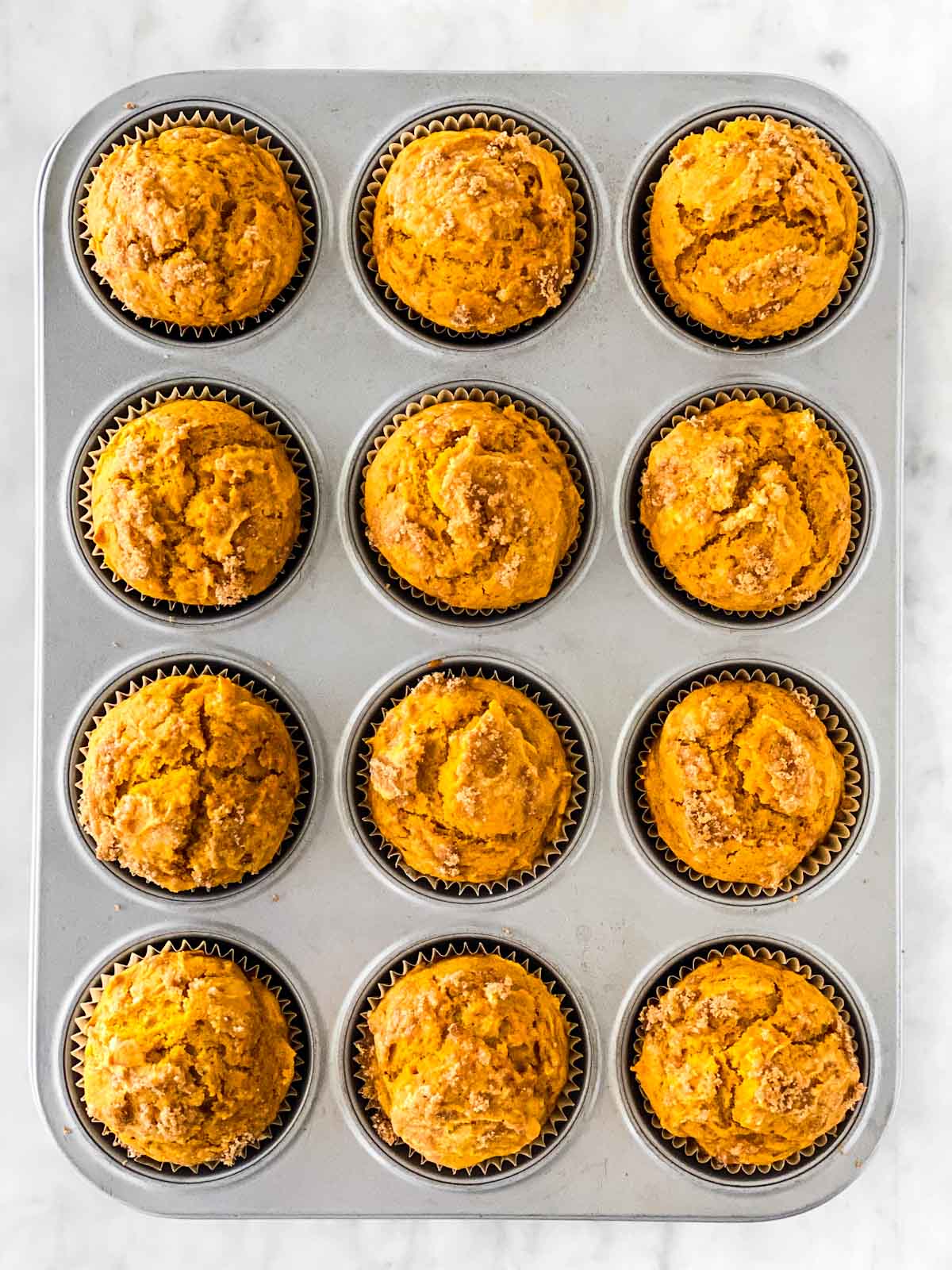 baked pumpkin muffins in muffin pan