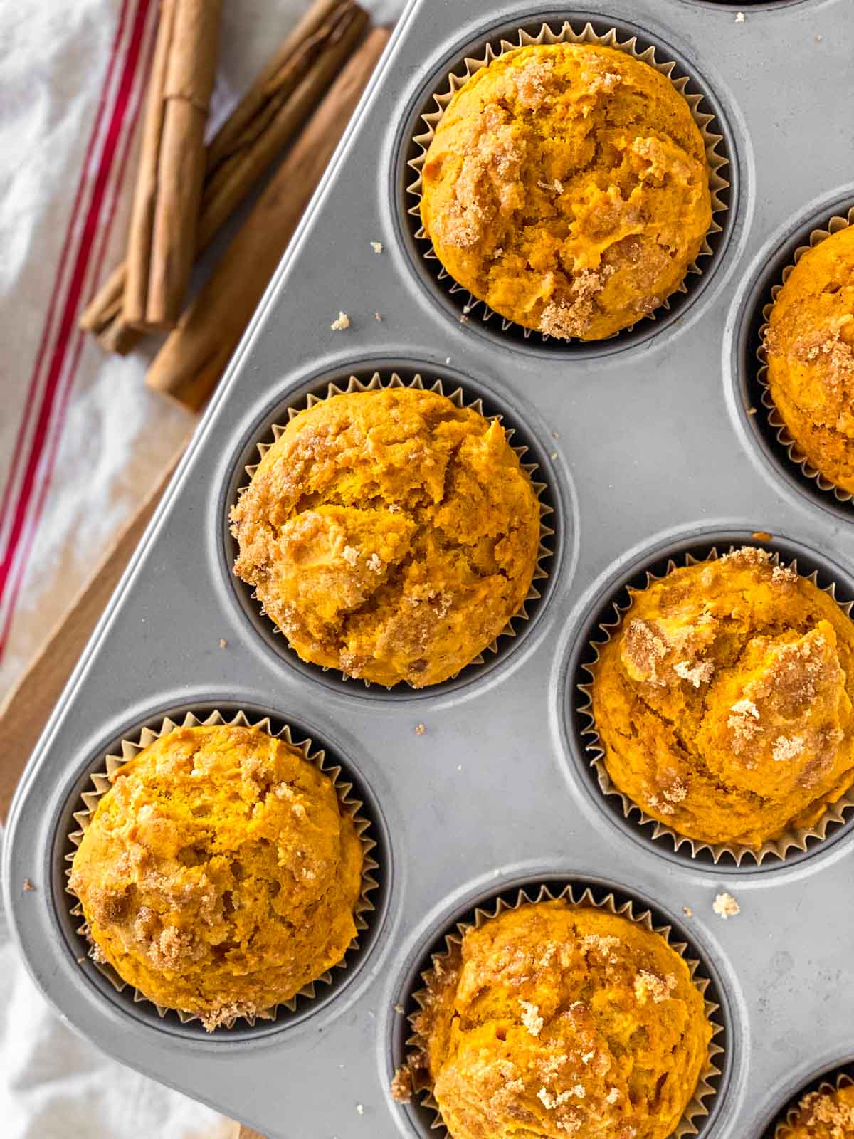 overhead close up view of cake mix pumpkin muffins in muffin pan