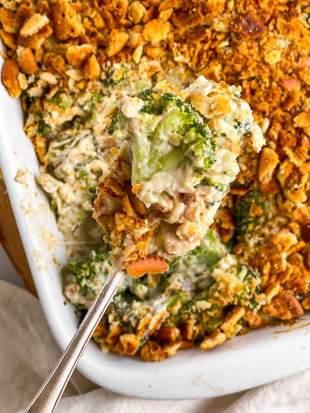 overhead view of spoon filled with ritz broccoli casserole