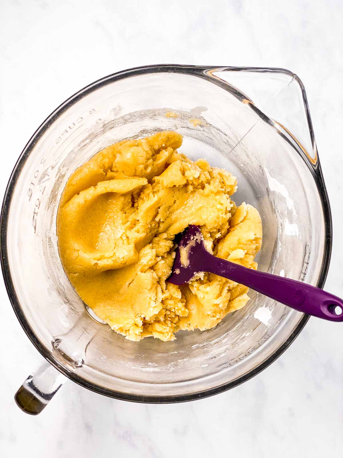 cookie dough for snickerdoodles in glass bowl