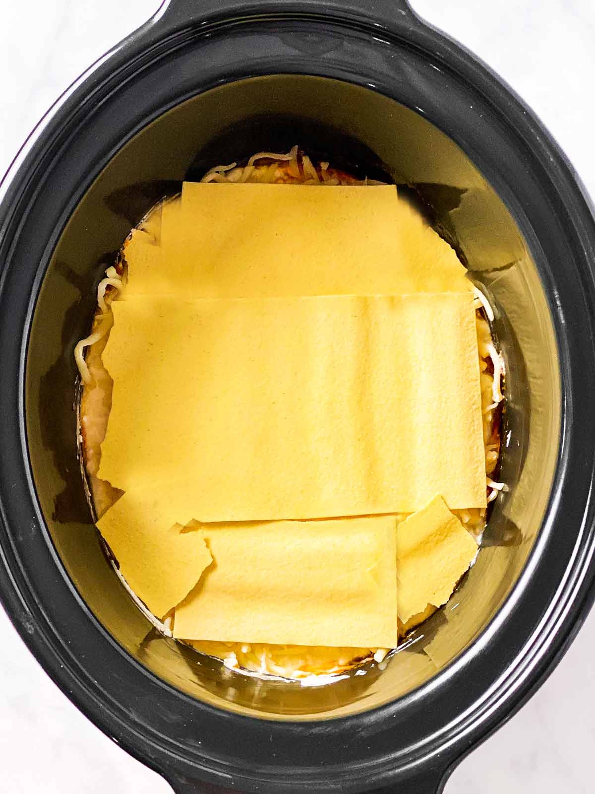 dry lasagna noodles in black crock (second layer)