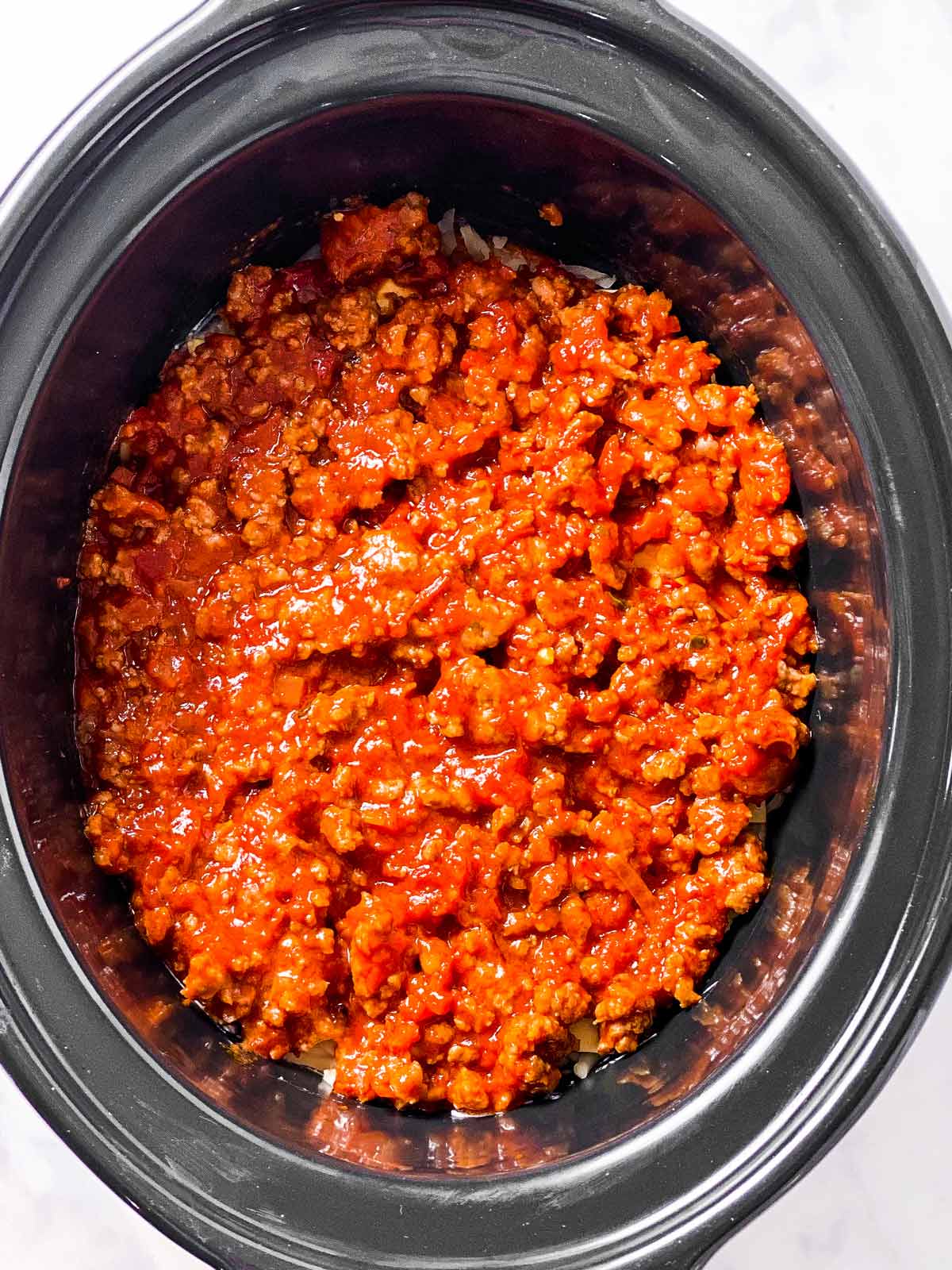 meat sauce in black crock (second layer)