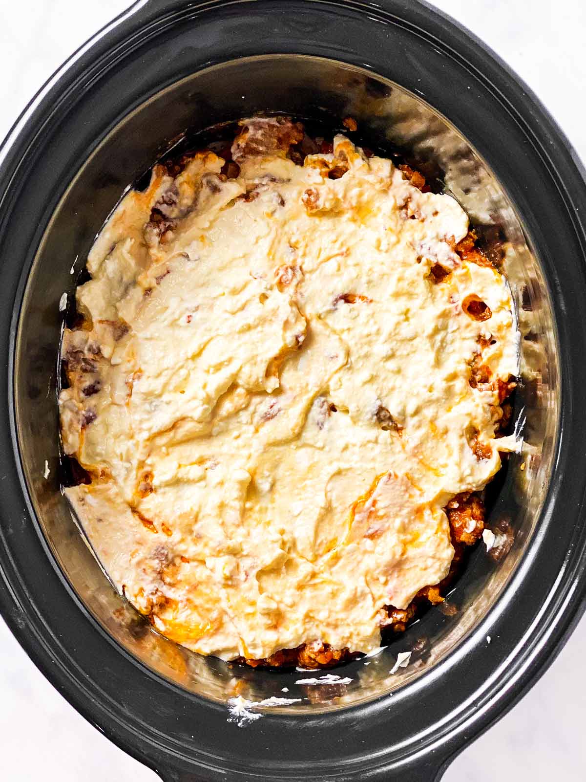 ricotta sauce in black crock (second layer)