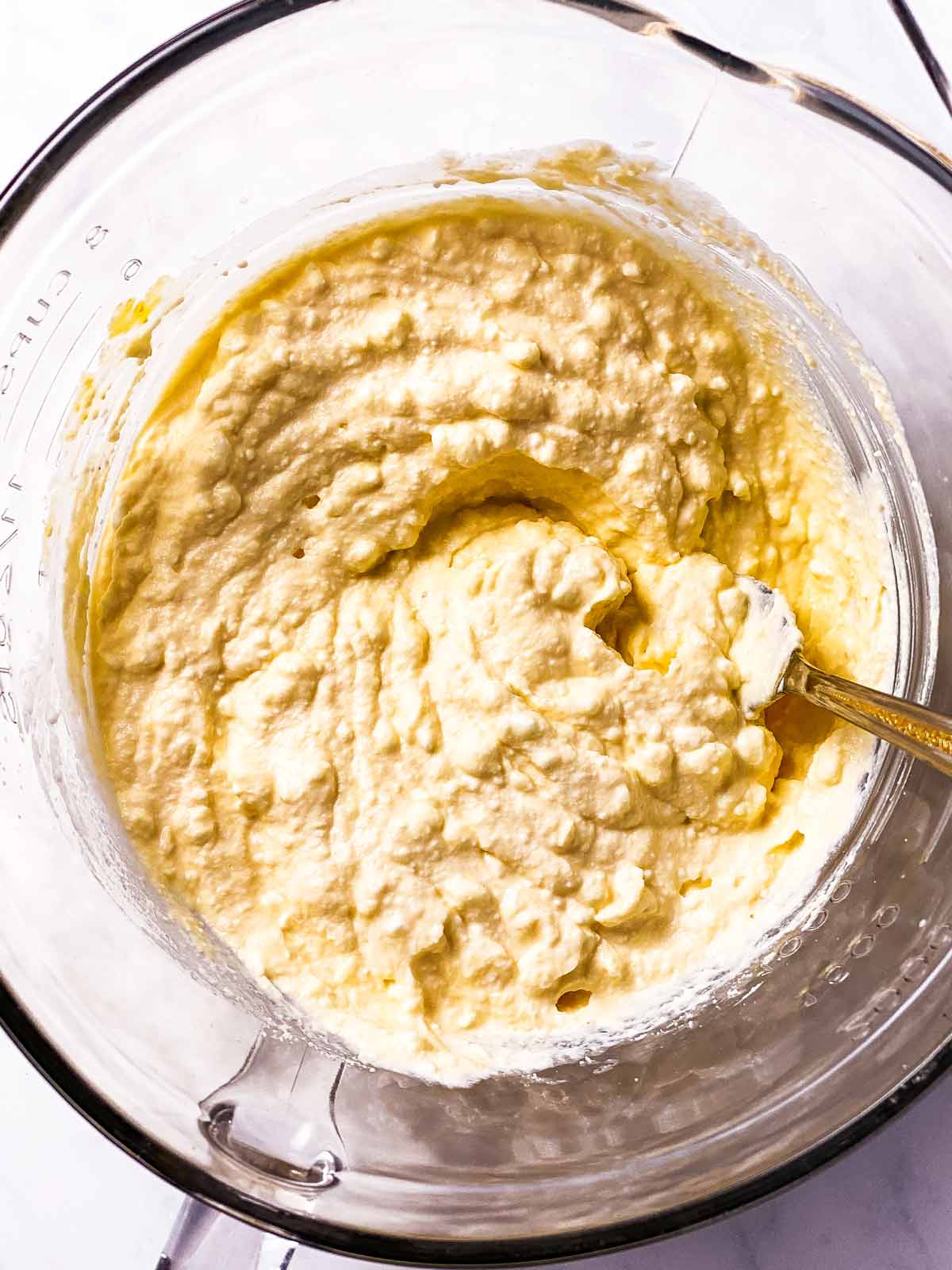 ricotta cheese sauce in glass bowl