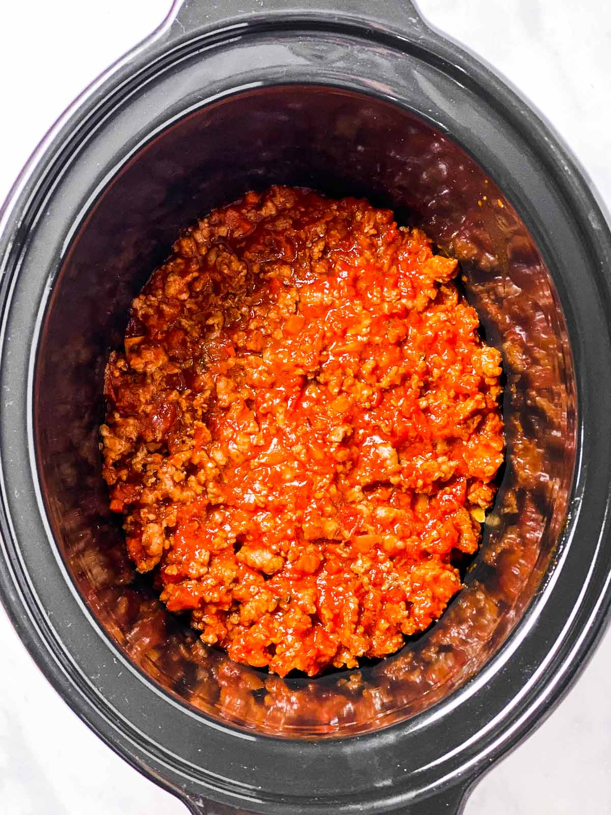 meat sauce in black crock