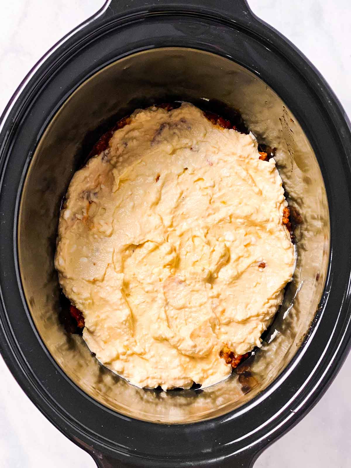 ricotta sauce in black crock