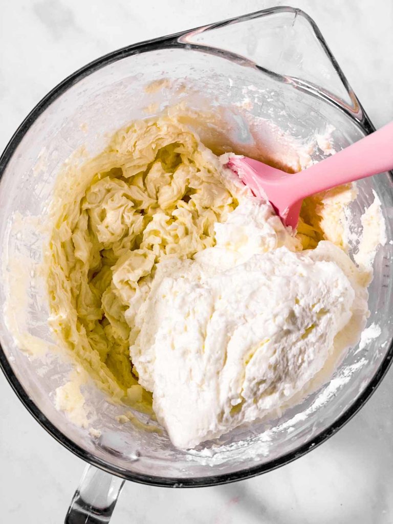 whipped topping in bowl with whipped cream cheese