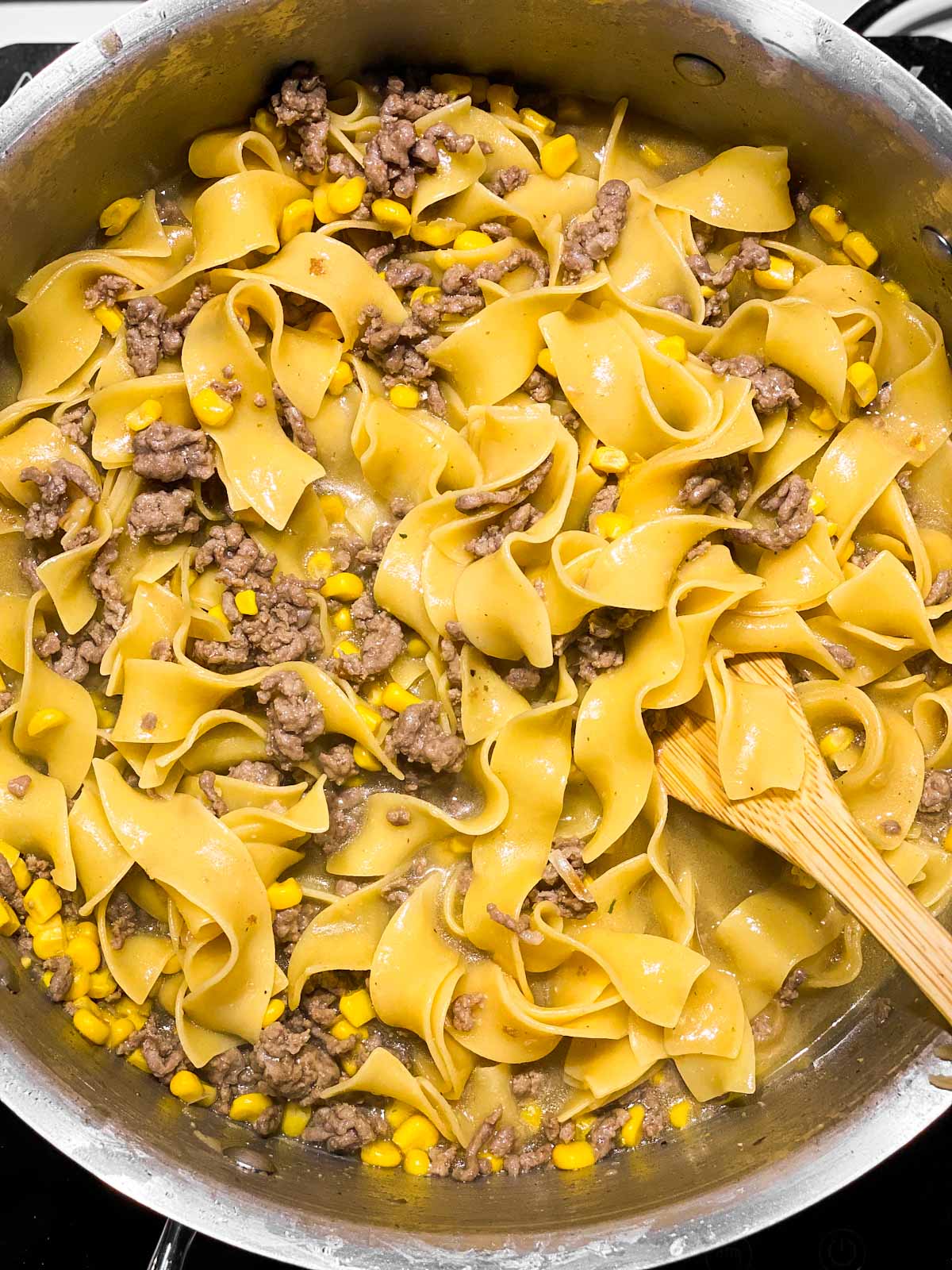 cooked noodles and ground beef in skillet