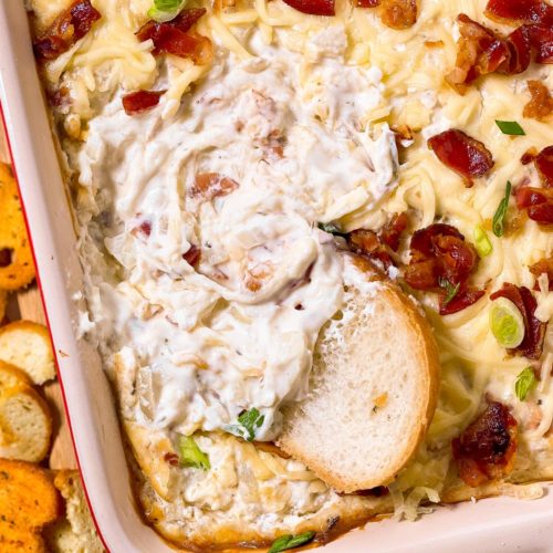 overhead view of baguette slice in dish with hot onion dip