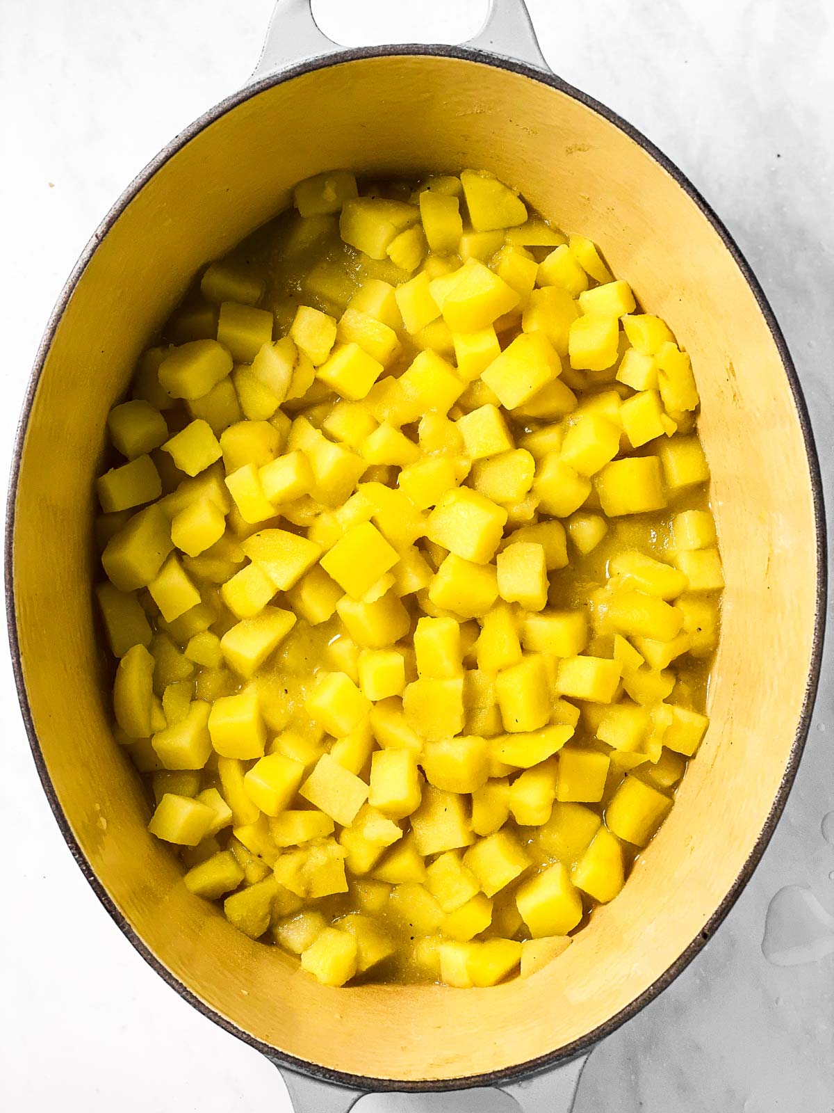 cooked potatoes in large oval pot