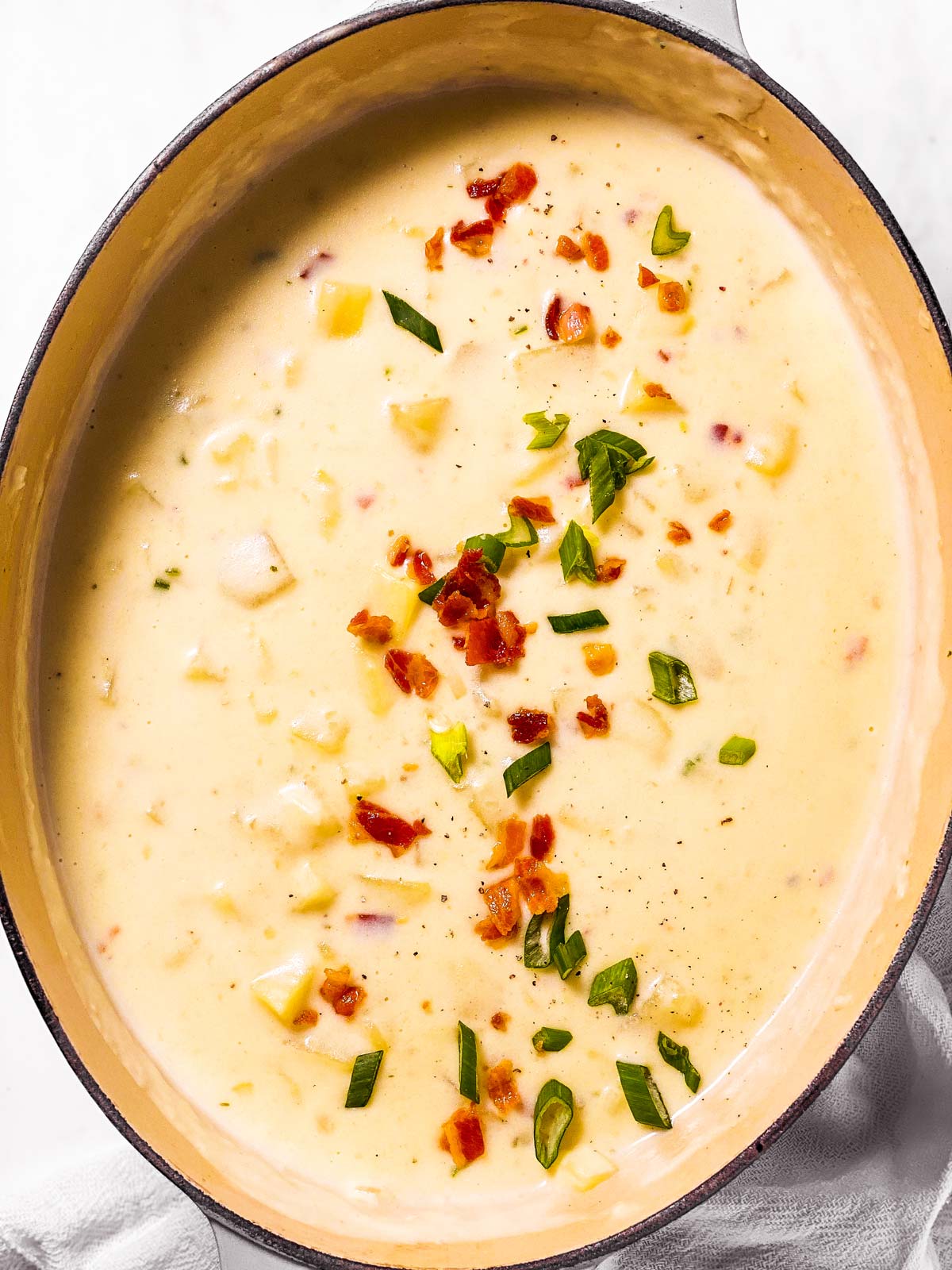 overhead view of potato soup in large oval Dutch oven