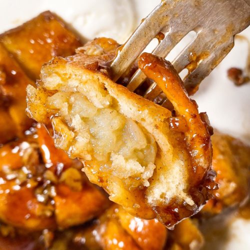 halved apple dumpling speared on fork