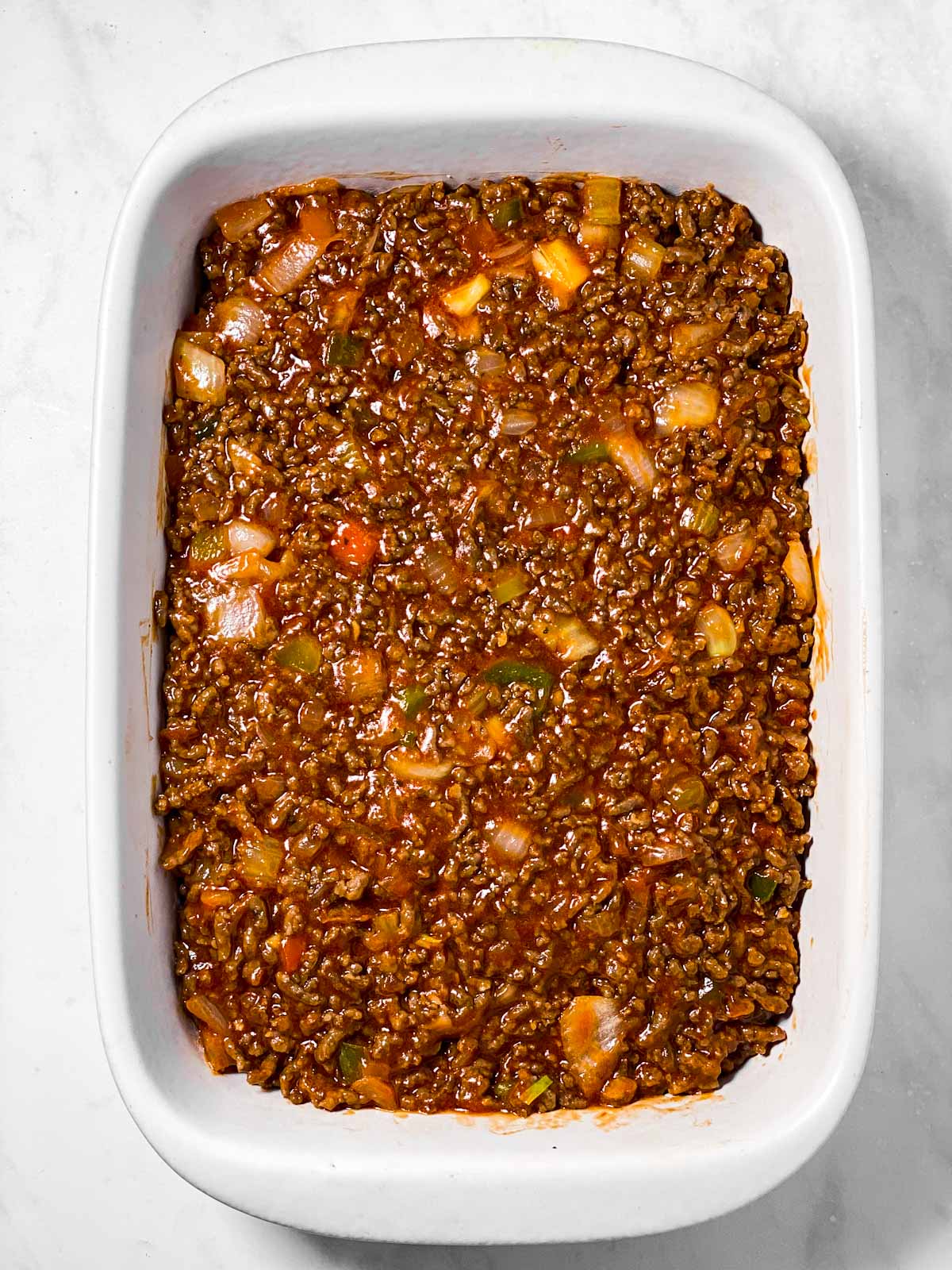 sloppy joe mixture in white casserole dish