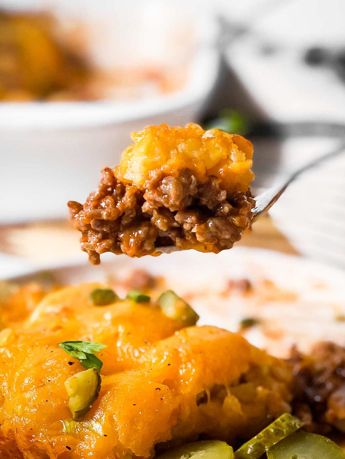 close up of fork with sloppy joe tater tot